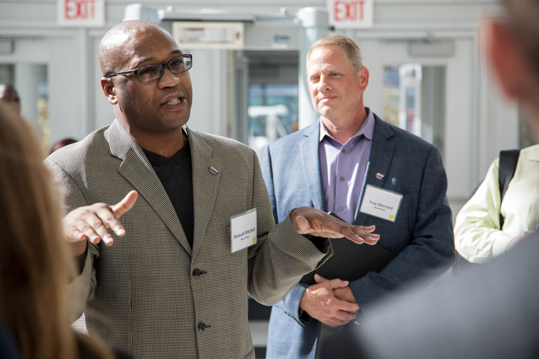 Renauld Mitchell, partner and director of operations in Chicago and Washington for Moody Nolan, told attendees about how the arena was designed and constructed. He was joined by Troy Sherrard (right) from Moody Nolan. (DePaul University/Jeff Carrion)